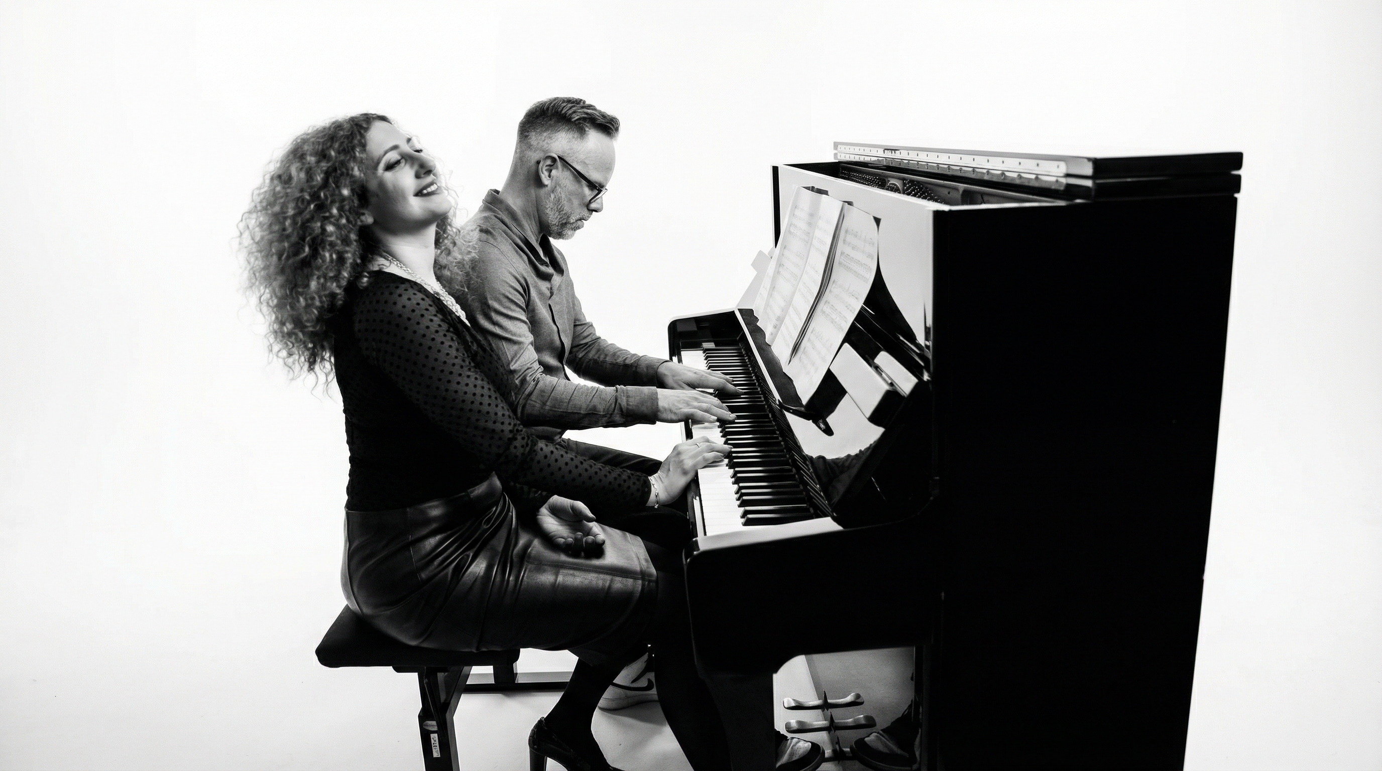 Curls & Pepper — Lina and Cedric at the grand piano